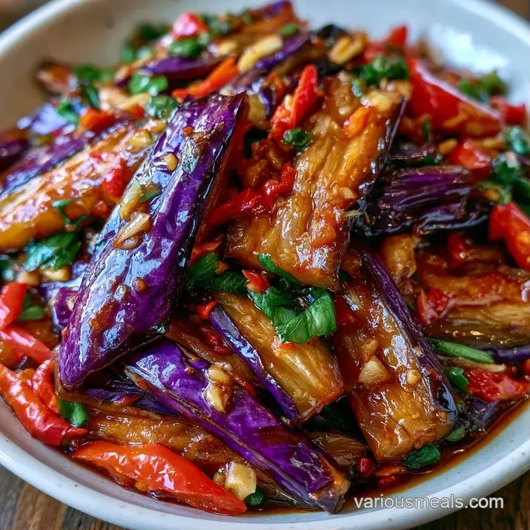 Glistening purple eggplant slices neatly stacked on a white plate, garnished with fresh green onion curls.