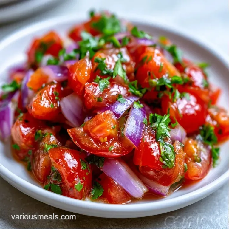 Colorful medley of diced red onions and cilantro served with crunchy corn tortilla chips on a slate platter.