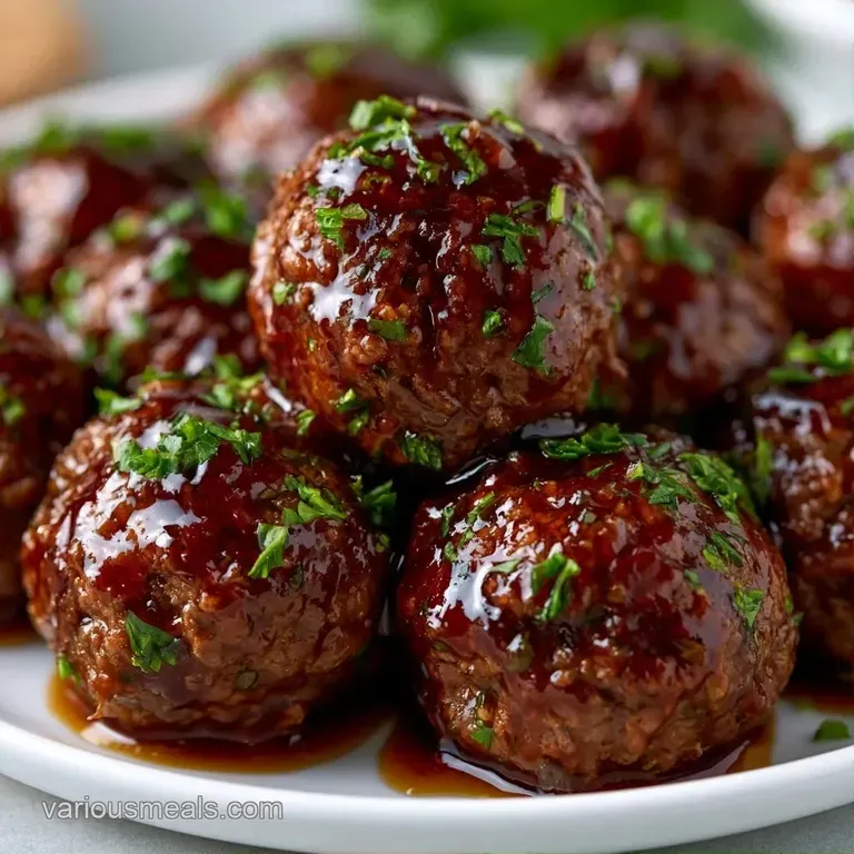 Glazed dark brown meatballs on elegant skewers, arranged on a rustic wood board with a side of creamy dipping sauce.