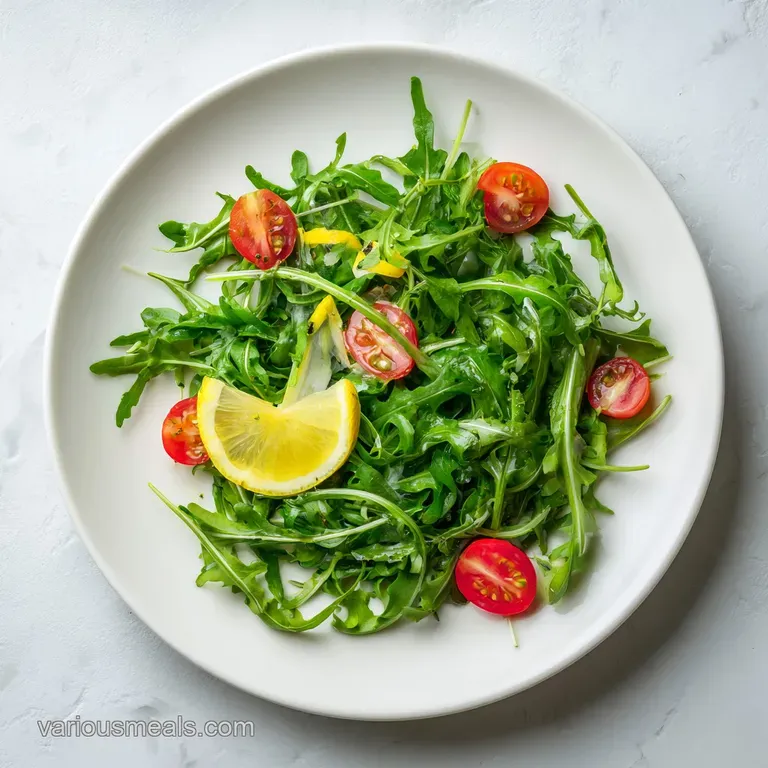 A delicate mound of peppery arugula dressed in glistening lemon vinaigrette, artfully arranged on a white plate.