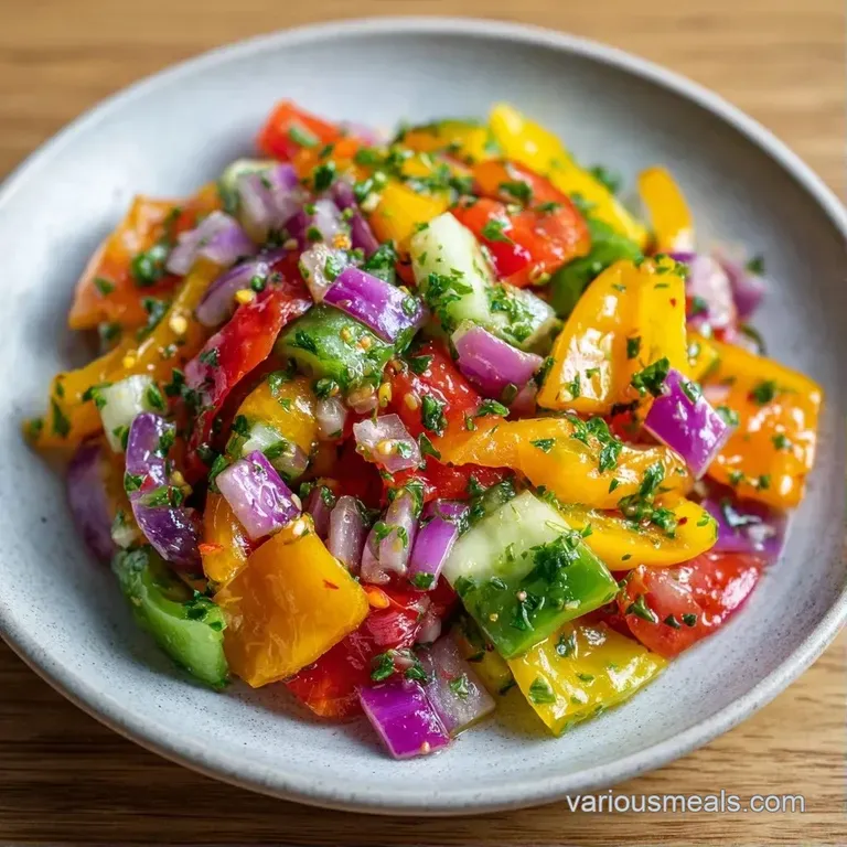 A bright medley of sliced sweet peppers elegantly arranged on a white plate, glistening under a light citrus glaze.