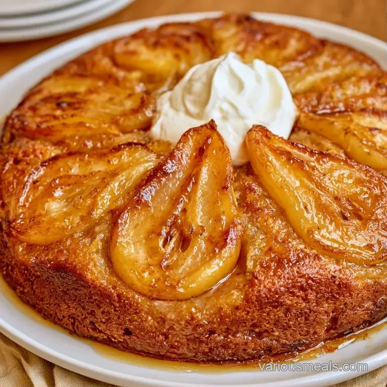 Elegant slice of buttery cake paired with a dollop of tart white cream on a minimalist white plate.