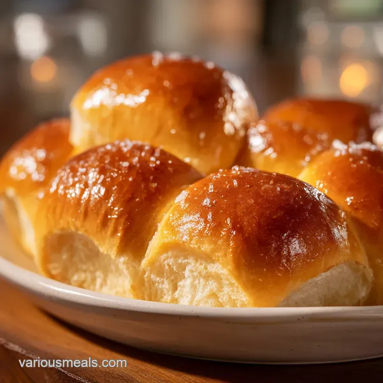 Warm, soft roll split open, slathered with whipped honey butter, steam rising enticingly. Sweet, comforting indulgence.
