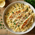 Garlic Parmesan Chicken Pasta served in a bowl with fresh parsley and grated parmesan